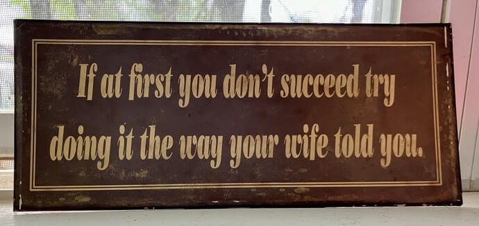 Funny sign with slogan in Missouri restaurant. Sign: If at first you don't succeed try doing it the way your wife told you.