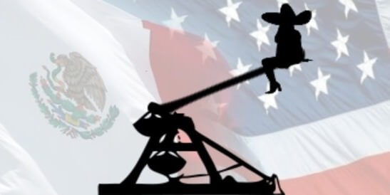 Profile of person in a sombrero sitting on a catapult