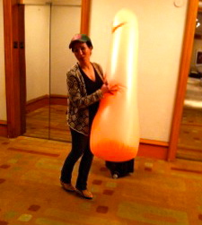 Funny photo of practical joke toy Practical Joke Ideas: photo of woman with giant blow-up adult toy on her way to a bridal shower.